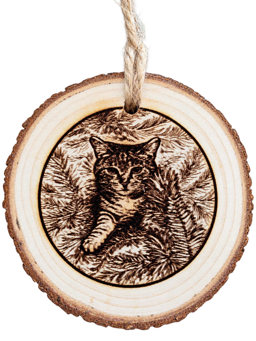 A cat portrait engraved on a wooden ornament